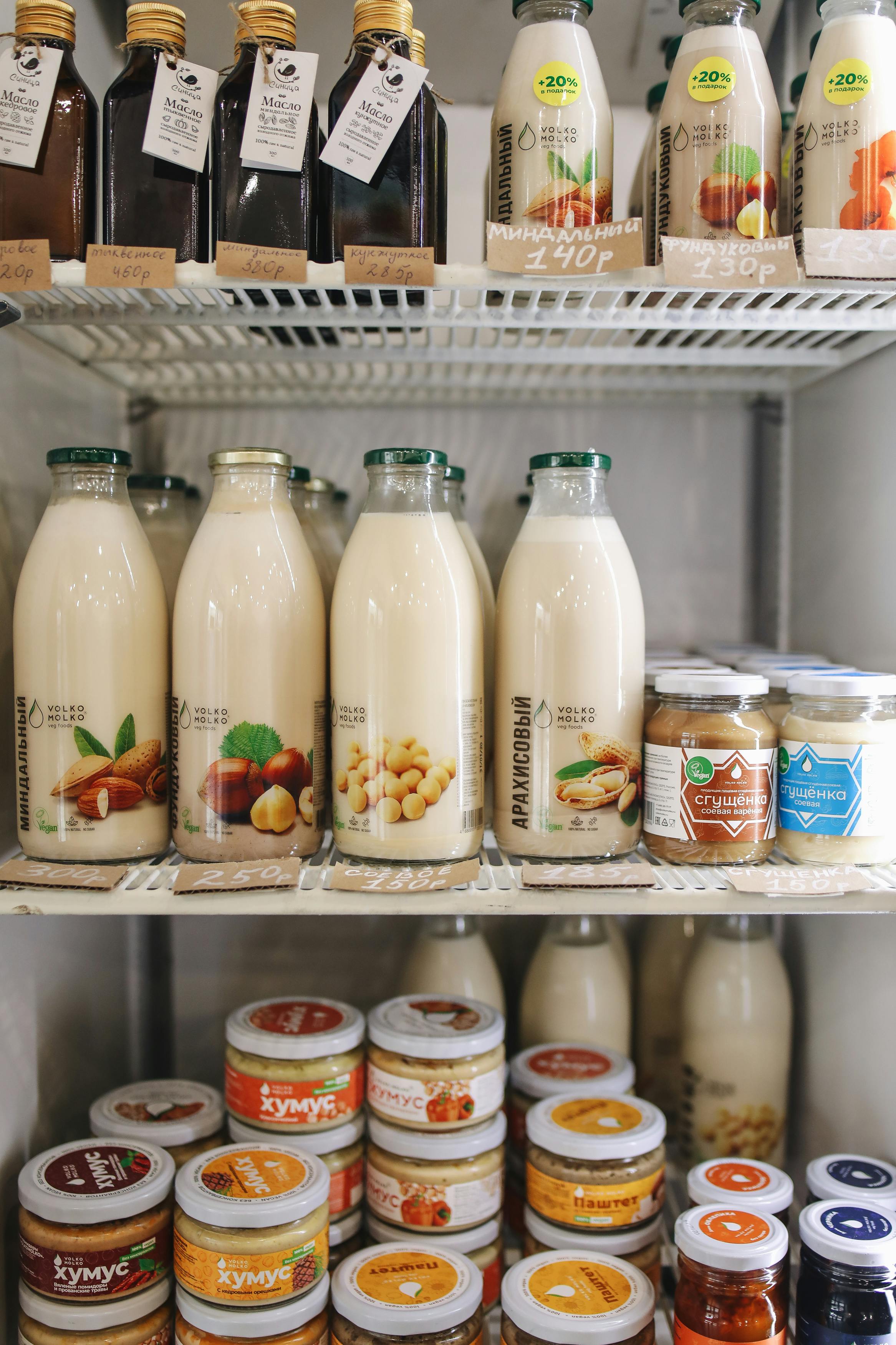 Dairy and milk bottles on refrigerator shelf