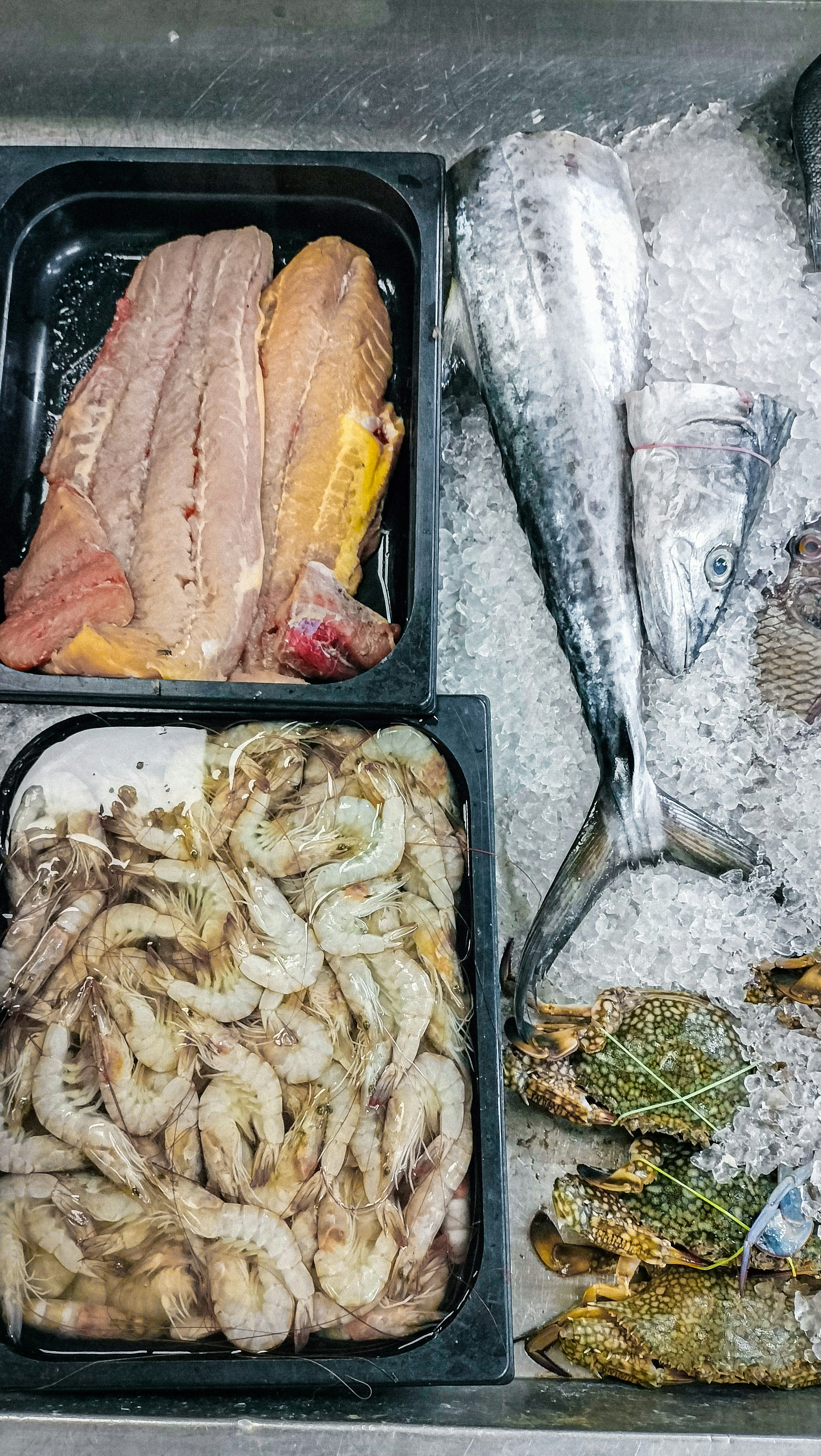 Fresh seafood display with shrimp and fish